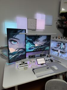 How to Build the Best Anime Gamer PC in 2025 (Even on a Budget) | Otazoo 3 Dual-monitor RGB anime gaming PC setup with custom accessories and waifu wallpaper