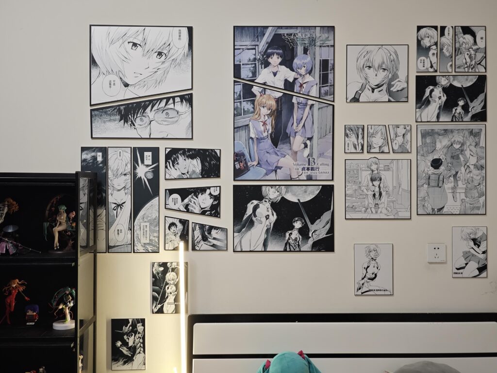 Top 10 Waifu Gifts for Your Gamer Boyfriend (That He’ll Secretly Love) | Otazoo 4 Evangelion manga-style wall display featuring Rei Ayanami and Asuka Langley panels