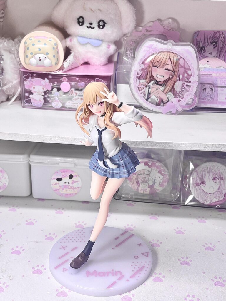 Best Lewd & Cute Anime Gifts for Your Gamer Boyfriend (2025 Edition) | Otazoo 4 Marin figure from My Dress-Up Darling with kawaii pink anime merch background