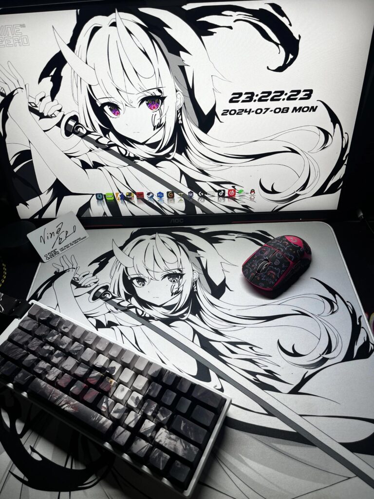 Turn Your Gaming PC into a Waifu Shrine: Anime Figure Display & Kawaii Desk Setup Ideas 2 Monochrome anime desk setup featuring custom mousepad, keycaps, and wallpaper in black and white with Oni-style waifu from Nin Zero