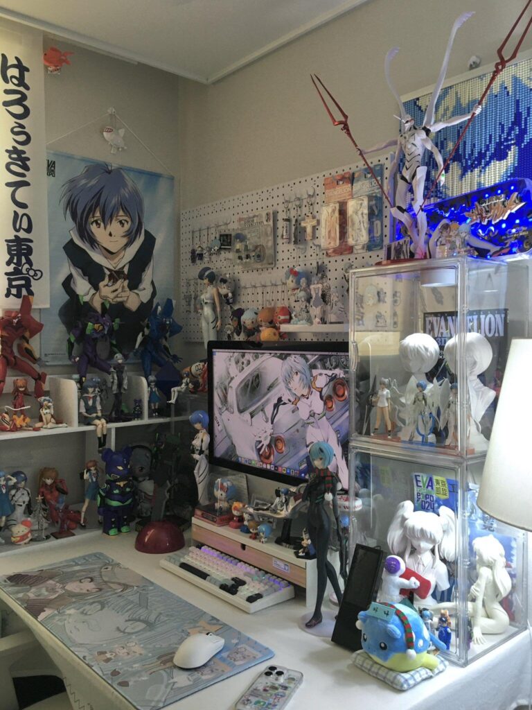 Top 10 Waifu Gifts for Your Gamer Boyfriend (That He’ll Secretly Love) | Otazoo 1 Rei Ayanami-themed Evangelion gaming setup — one of the most aesthetic waifu gift ideas for fans of classic anime, complete with figures, deskmat, and custom keycaps.