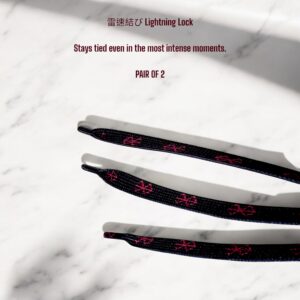Close-up of Berserk shoelaces showing lightning lock tips with red embroidery
