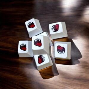 Close-up of White Boo Gaming Keycaps on wood with sunlight shadows