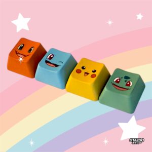 Yellow orange blue green Pokemon-inspired gaming keycaps on pastel rainbow background