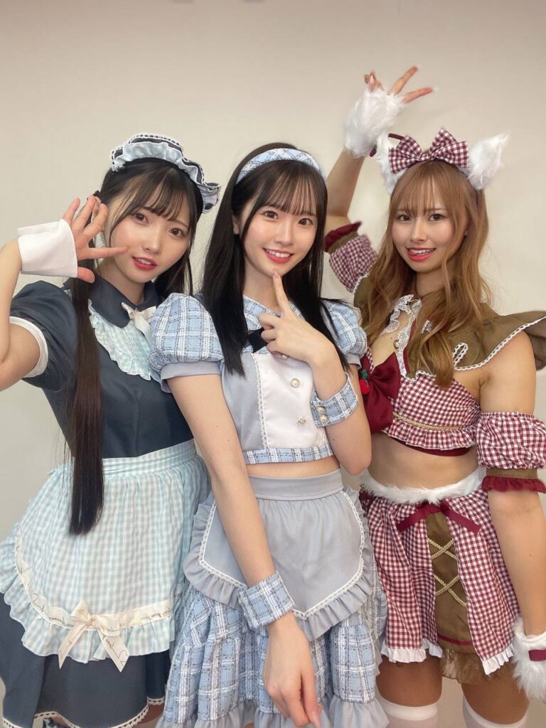 What It’s Really Like at a Maid Cafe in Japan (2025 Experience) 1 Three maids in cosplay outfits posing at a maid cafe in Japan