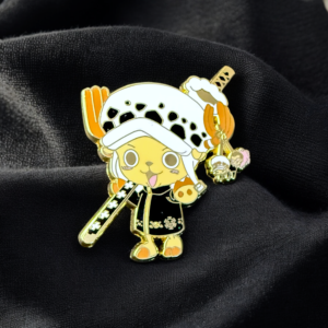 Yellow Chopper enamel pin dressed as Law resting on soft black cloth