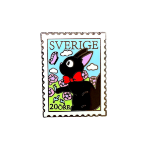 Front view of Jiji postage stamp enamel pin on white background