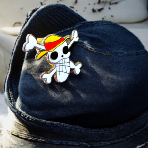 Luffy Jolly Roger pin attached to a denim cap