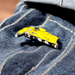 Cute Pikachu enamel pin with shiny surface on dark jeans