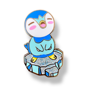 Blue and white piplup enamel pin standing on glitter ice platform