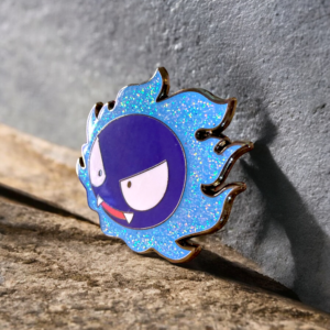 Pokemon enamel pin showing Gastly in flame on stone background