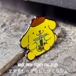 Sanrio enamel pin showing Pompompurin holding bubble tea on stone surface