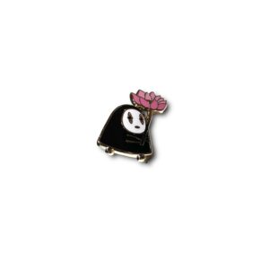 Spirited Away enamel pin showing No Face holding pink lotus flower on white background