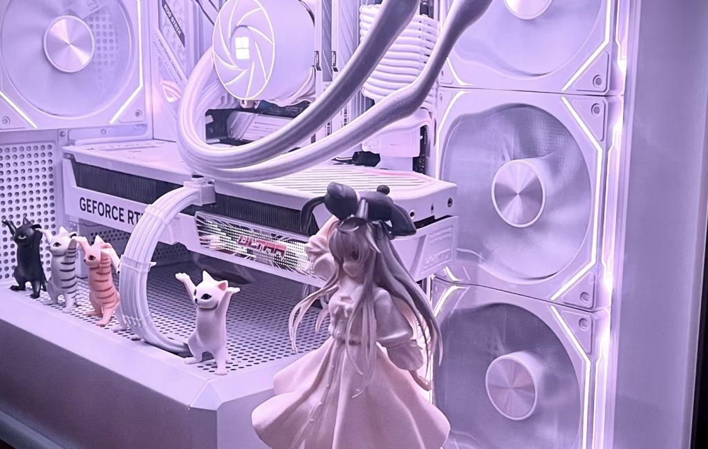 kawaii-pc-setup-cat-figures Kawaii pastel anime figure display inside RGB-lit gaming PC buildKawaii pastel anime figure display inside RGB-lit gaming PC build